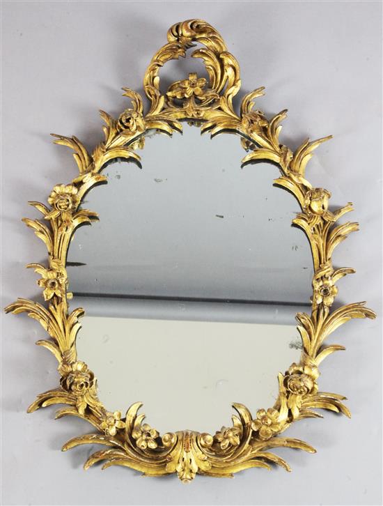 A Victorian carved giltwood wall mirror, W.2ft 3in. H.3ft 1in.